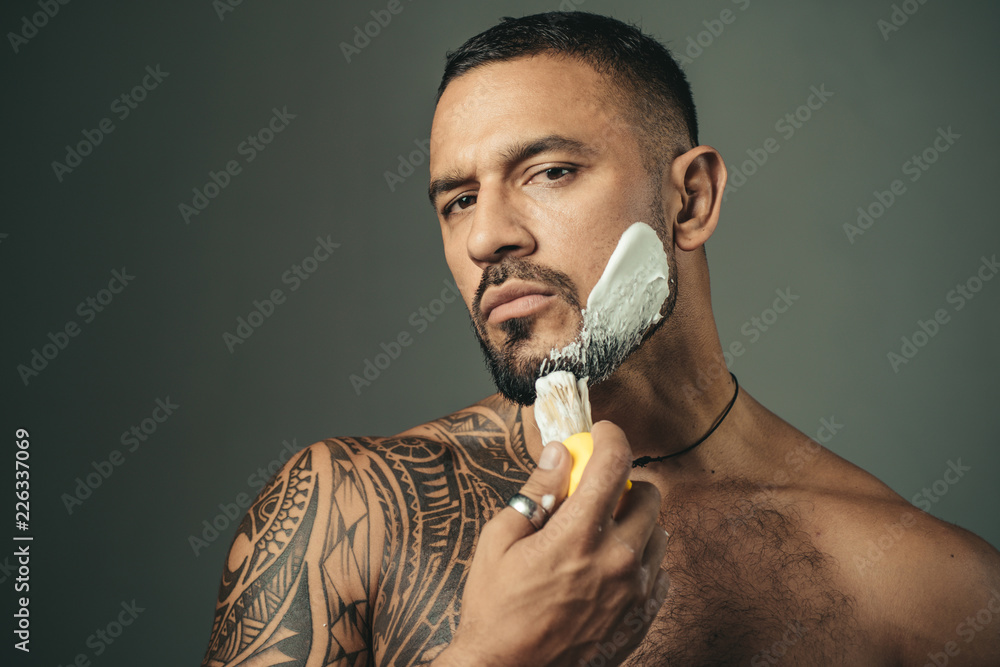 Razor sharp. Barber Shop Studios. Bearded man getting haircut by  hairdresser and sitting in chair at barbershop. Hair style and hair  stylist. Beard care. Moustache Wax. Beard styling and cut. Stock Photo |