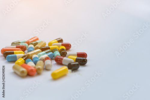Antibiotic. Medicine capsules on white background with copy space. Drug prescription for treatment medication.