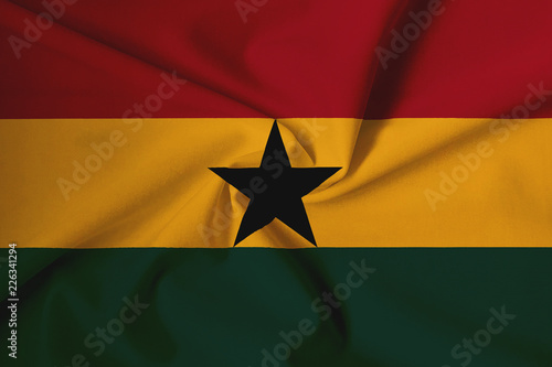 Waving Ghana flag with a fabric texture