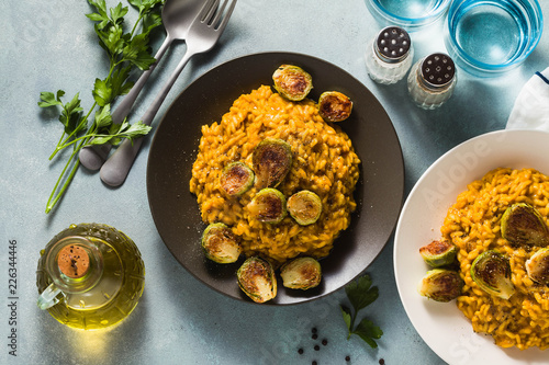 risotto with pumpkin and brussels sprouts on the table. A healthy recipe for the whole family. festive table