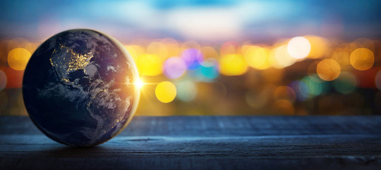 Planet earth on the background of blurred lights of the city. Concept on business, politics, ecology and media.  Elements of this image furnished by NASA