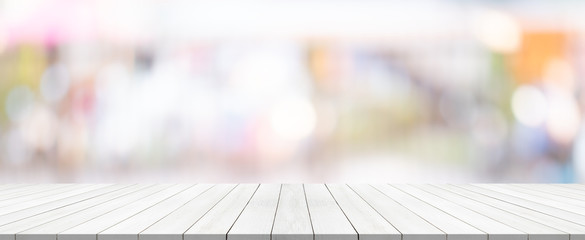 white wood table top on blurred background from shopping mall, Space for montage your product