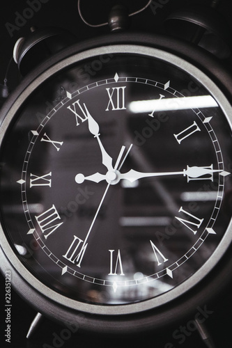 Vintage roman clock face close up. Clock hand close up, time concept. 