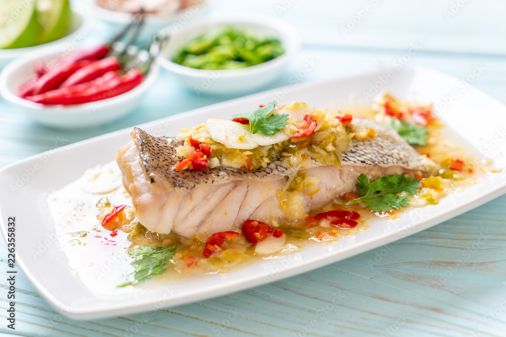Steamed Grouper Fish Fillet with Chili Lime Sauce in lime dressing Steamed Grouper Fish Fillet with Chili Lime Sauce in lime dressing