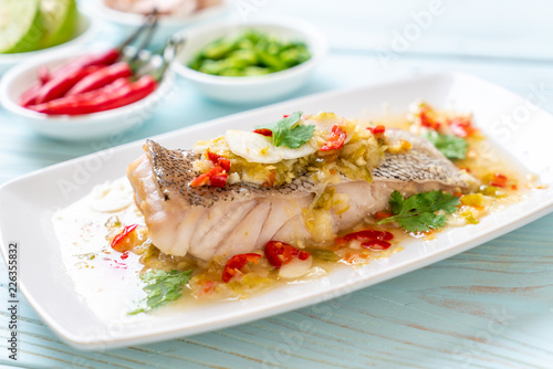 Steamed Grouper Fish Fillet with Chili Lime Sauce in lime dressing photo