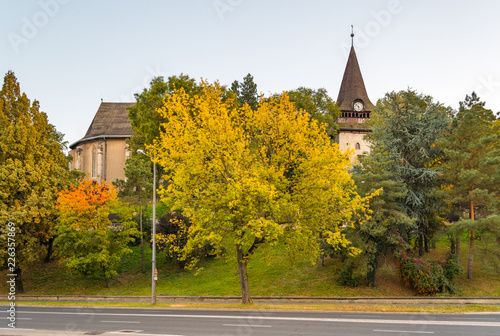 Avas Church and bell tower in Miskolc in autumn colors on top of Avas Hill photo
