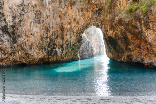 Natural Arch of Arcomagno San Nicola Arcella, Tyrrhenian Sea, South of Italy. © tanialerro