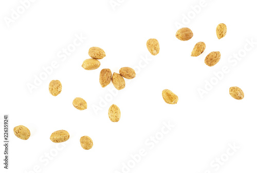Roasted salted peanuts isolated on a white background, top view.
