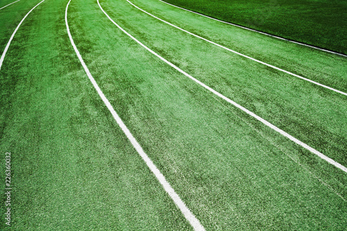 Empty running track with artificial turf