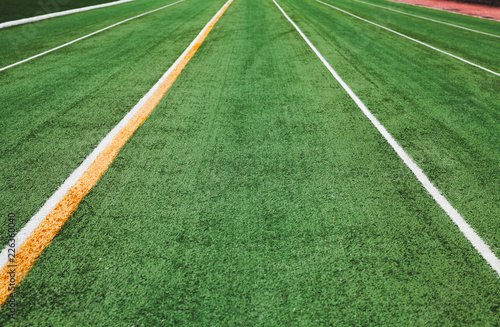 Empty green running track perspective