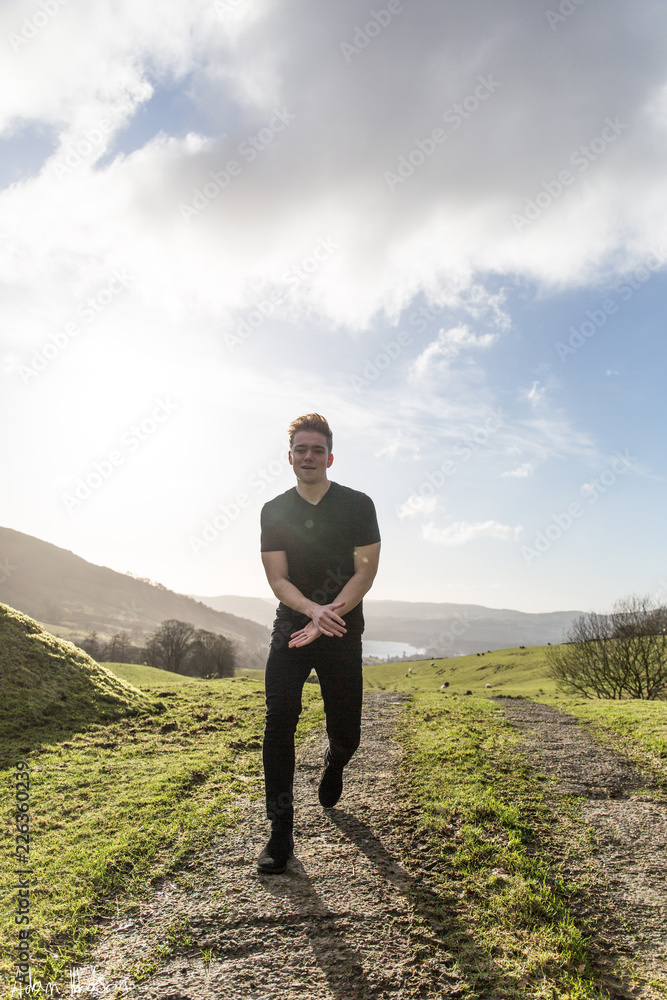 Man Walking Into Valley With Lake Man Walking Into Valley With Lake