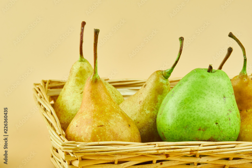 Tasty and fresh pears in wooden basket Tasty and fresh pears in wooden basket