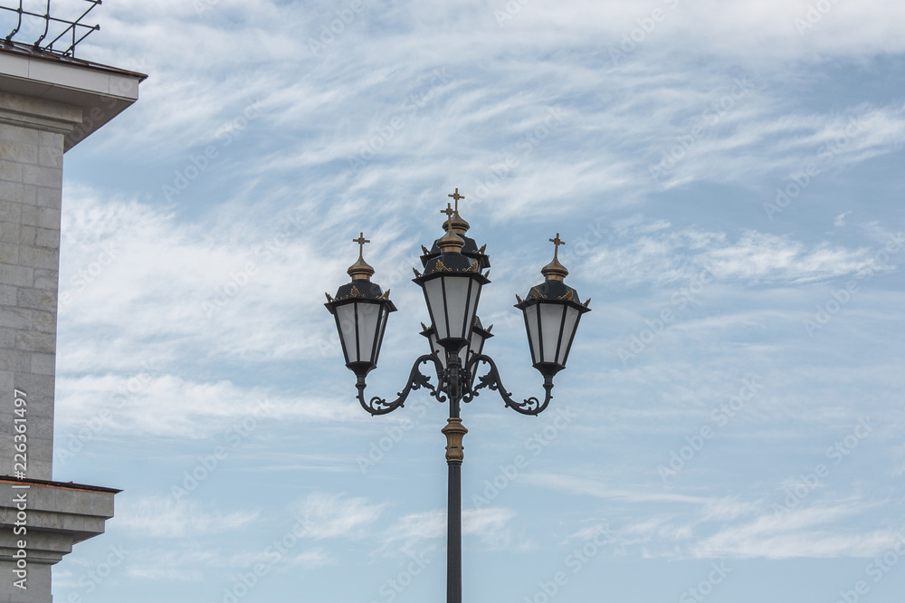 street lamp next to the building wall