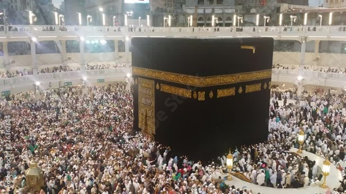 4K footage Muslim pilgrims circumambulate the Kaaba at Masjidil Haram in Makkah, Saudi Arabia. Muslims all around the world face the Kaaba during prayer time. photo