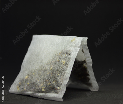Wallpaper Mural two square tea bags on a black background Torontodigital.ca