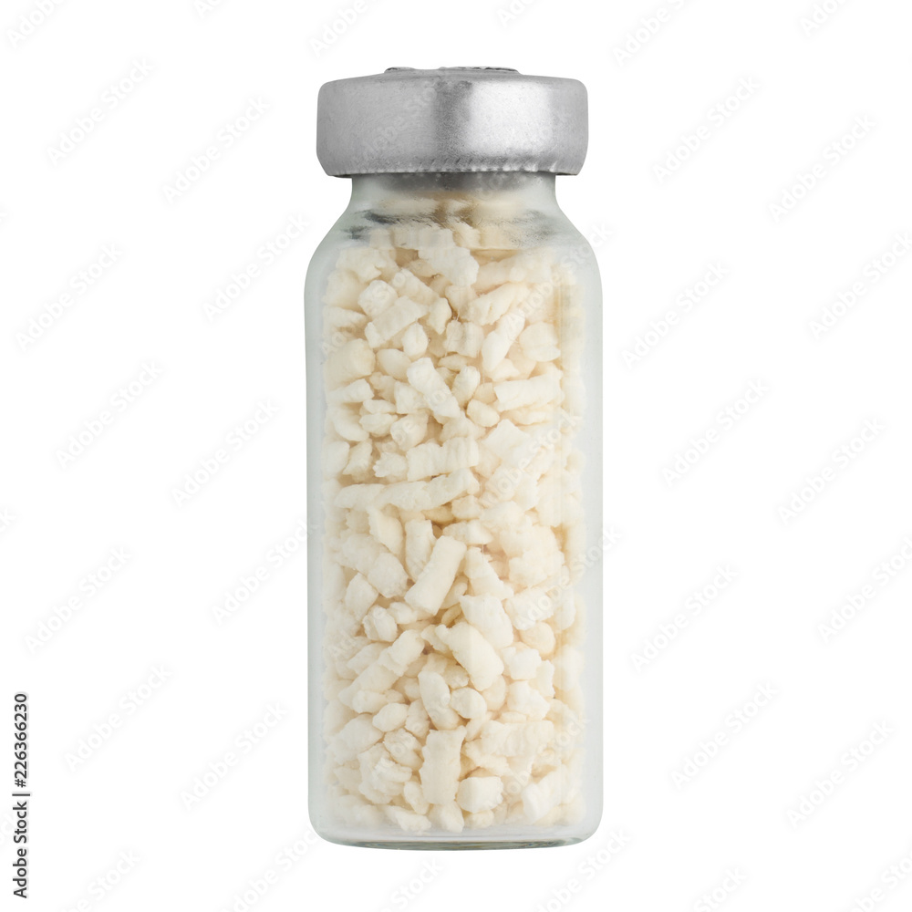 dry royal jelly in granules, adsorbed royal jelly in a glass ampoule, isolated on a white background dry royal jelly in granules, adsorbed royal jelly in a glass ampoule, isolated on a white background