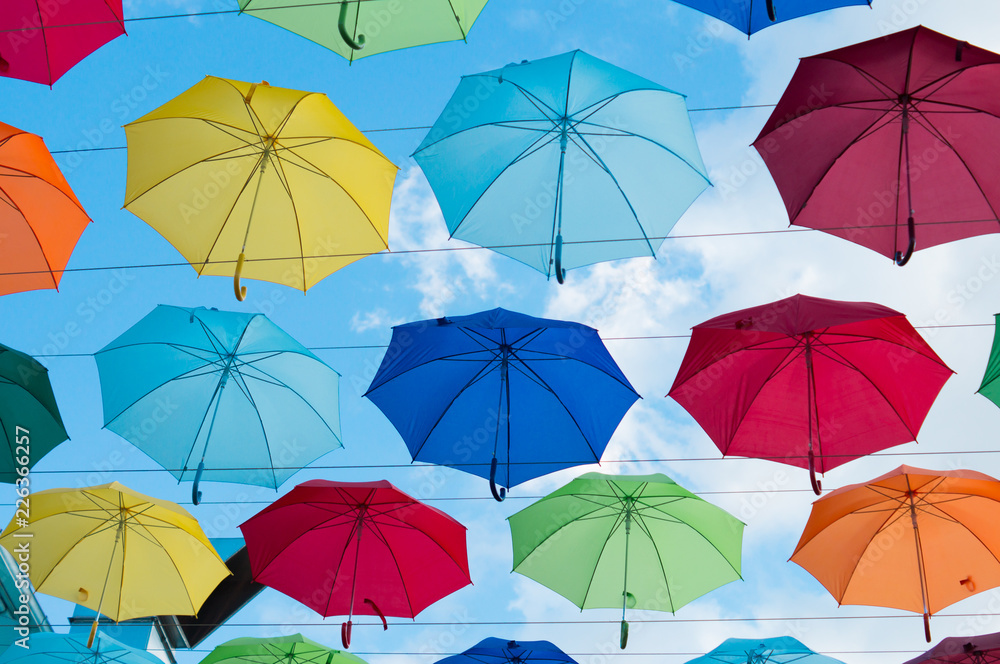 hanging colorful umbrellas on a sunny day