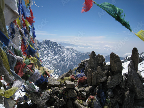Buddhist prayer flags at the summit of a high pass on the Gosaikunda trek in the Langtang range of the Himalayas, Nepal