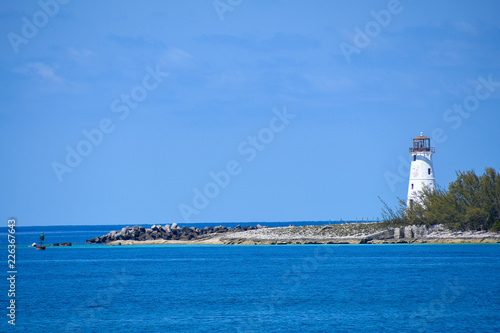 white lighthouse at entrance of Paradise Island Harbor in Nassau Bahamas