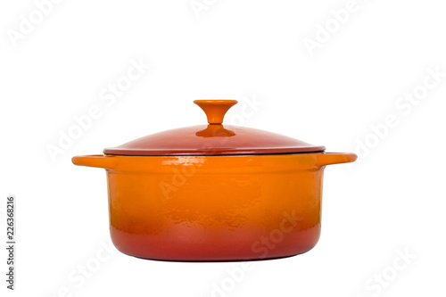 Orange cast iron pan with lid on white background.