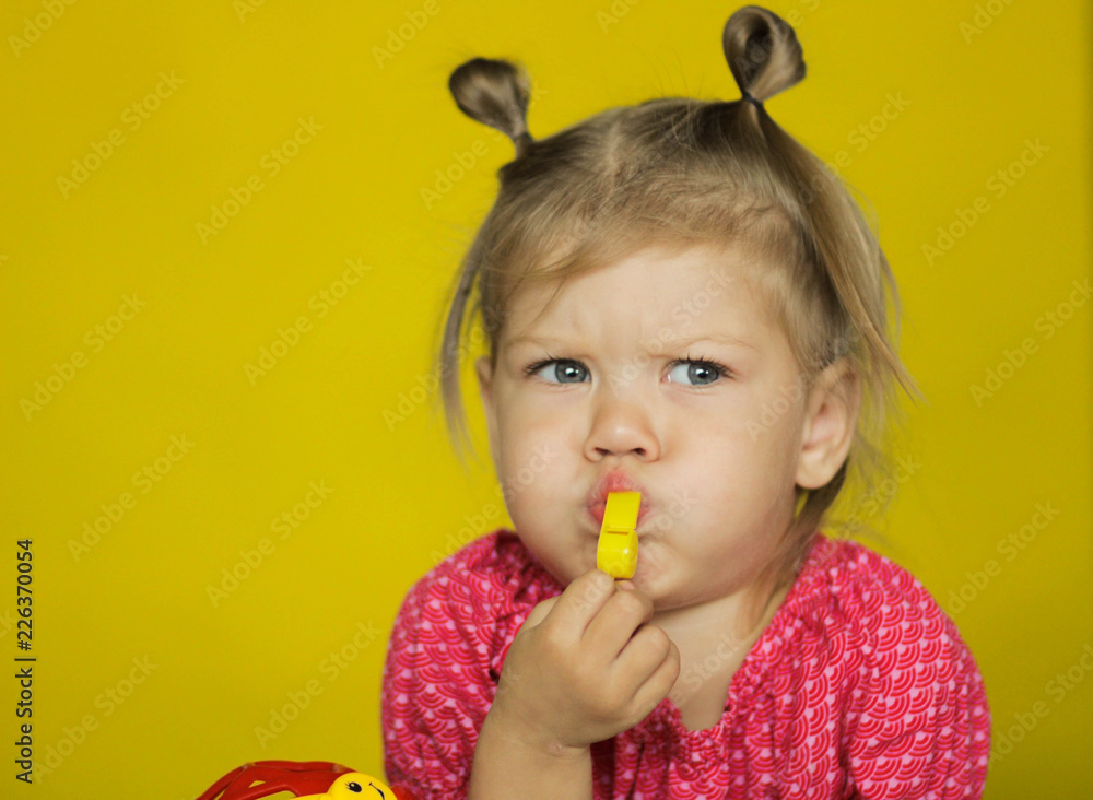 cute child blowing the whistle Stock Photo Adobe Stock