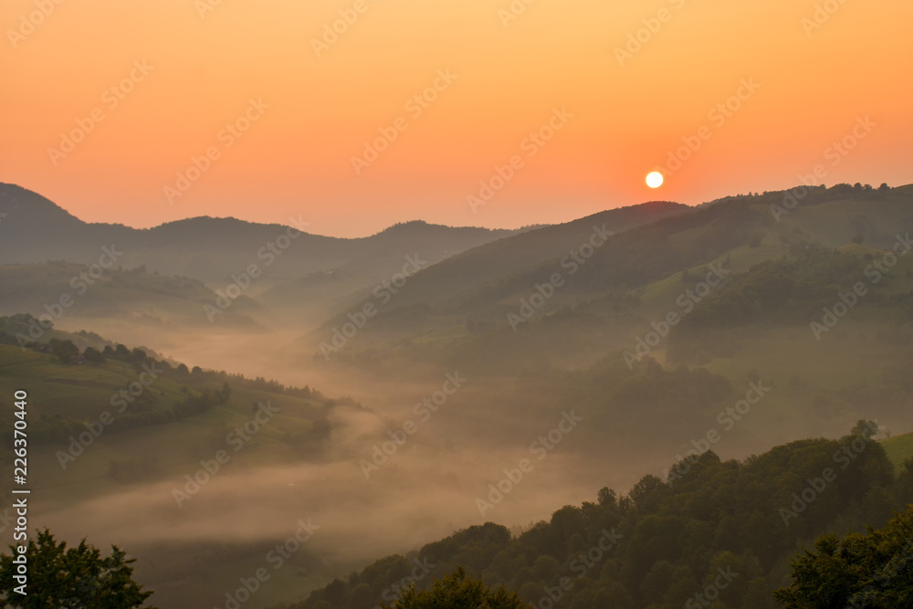 Beautiful from the nature with fog and clouds at sunrise