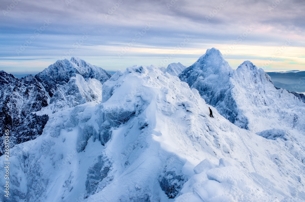 Beautiful winter landscape with lonely climber and snowed mountains, Slovakia
