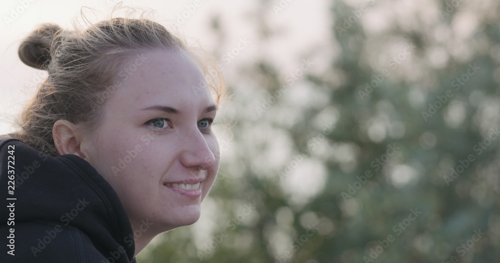 young female portrait sitting on a seashore with thoughtful look young female portrait sitting on a seashore with thoughtful look
