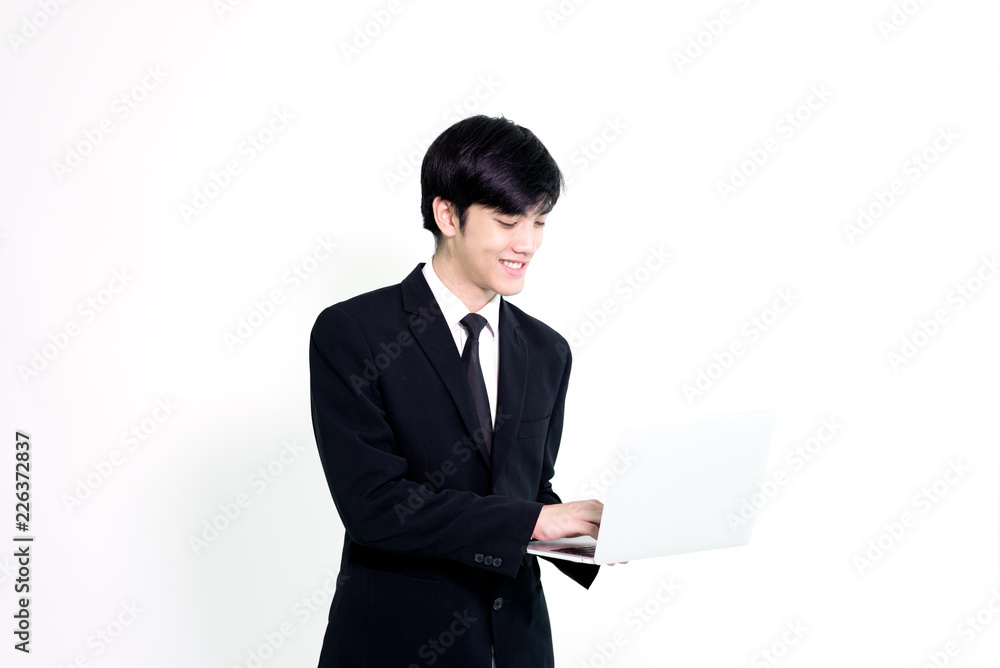 Asian business handsome man has holding laptop for woking with happy and relaxing isolated on white background. Asian business handsome man has holding laptop for woking with happy and relaxing isolated on white background.