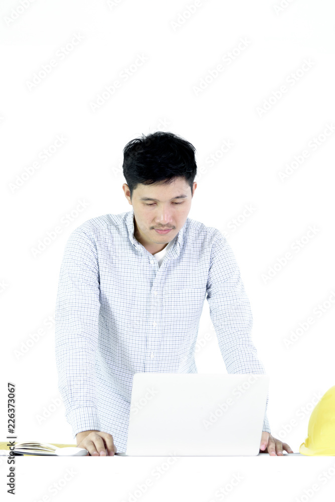 Asian employee engineer salary man sitting at desk and working with feeling worry and boring, isolated on white background. Asian employee engineer salary man sitting at desk and working with feeling worry and boring, isolated on white background.