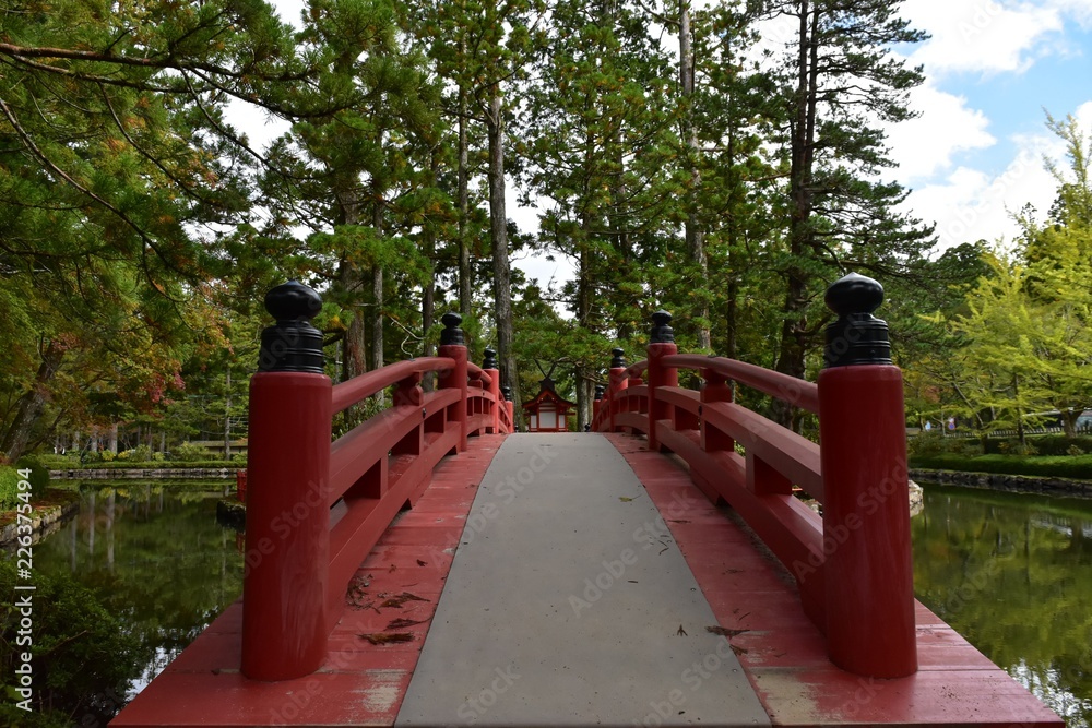 Pond and red bridge next to Koyasan middle gate Pond and red bridge next to Koyasan middle gate