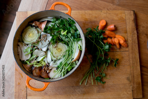 ingredients for stock in an orange pot photo