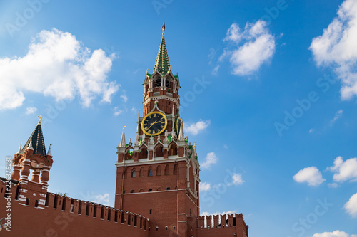 The famous Spasskaya tower of Moscow Kremlin, Russia. Spasskaya tower on the blue sky background. Beautiful view of Spasskaya tower in the sunlight.