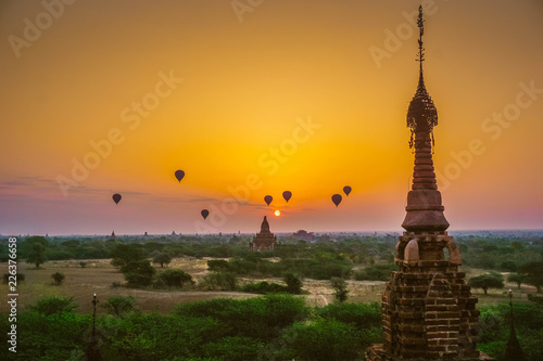 A beautiful sunrise with balloons floating in the air in Bagan is a city of thousands of Buddhist pagodas. Myanmar