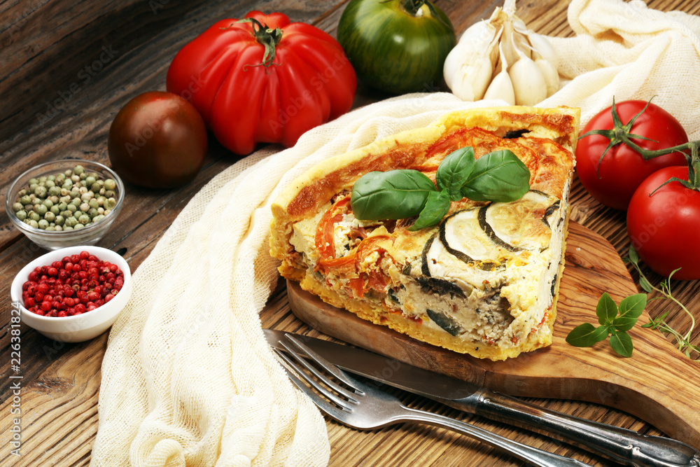 Homemade Cheesy Egg Quiche for Brunch with Spinach and Tomato, onions and zucchini. Homemade Cheesy Egg Quiche for Brunch with Spinach and Tomato, onions and zucchini.