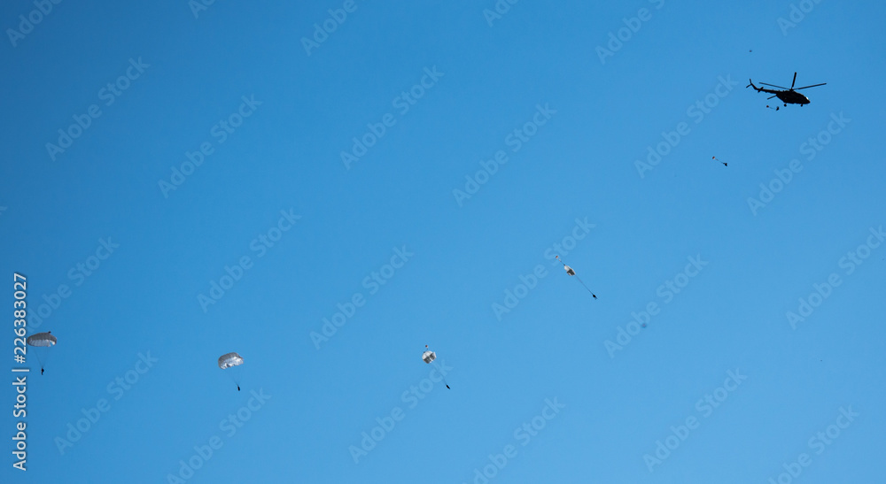 against the blue sky jumping skydiver on