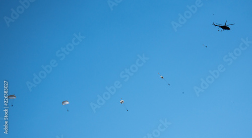 against the blue sky jumping skydiver on