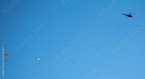 against the blue sky jumping skydiver on