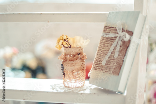 Delicate composition with flowers in a vase
