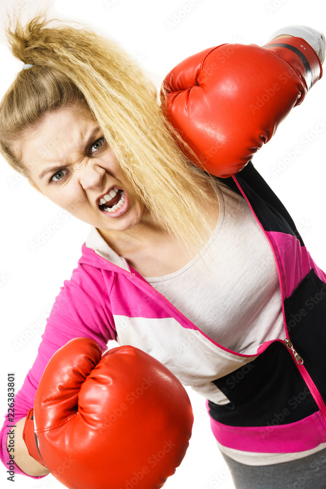 Angry woman wearing boxing gloves