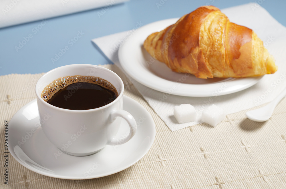 Coffee with croissant on table Coffee with croissant on table