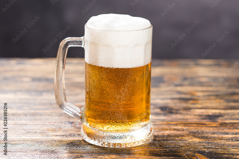 Alcohol, liquid, food concept - mug of beer on a table Alcohol, liquid, food concept - mug of beer on a table
