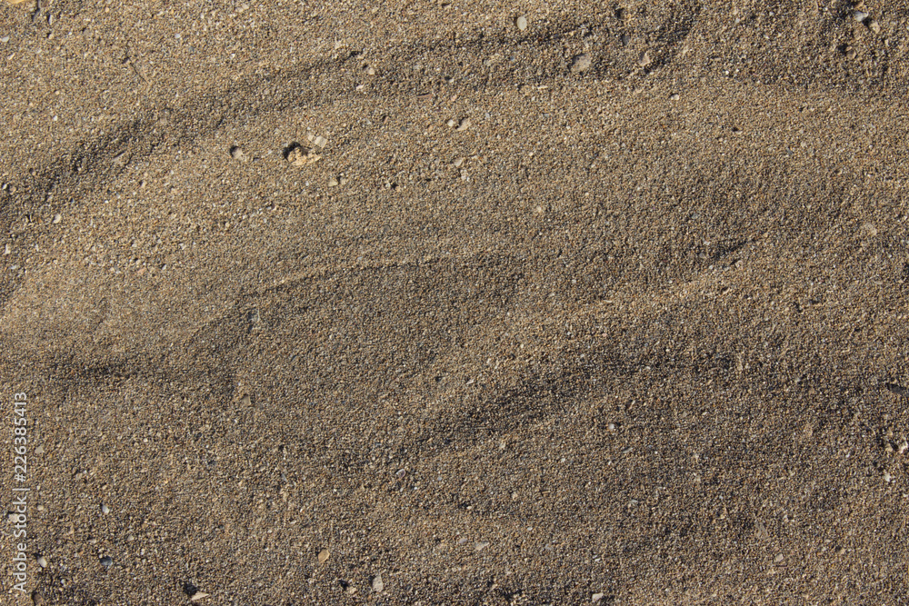 Texture of beach sand on the sea coast Texture of beach sand on the sea coast
