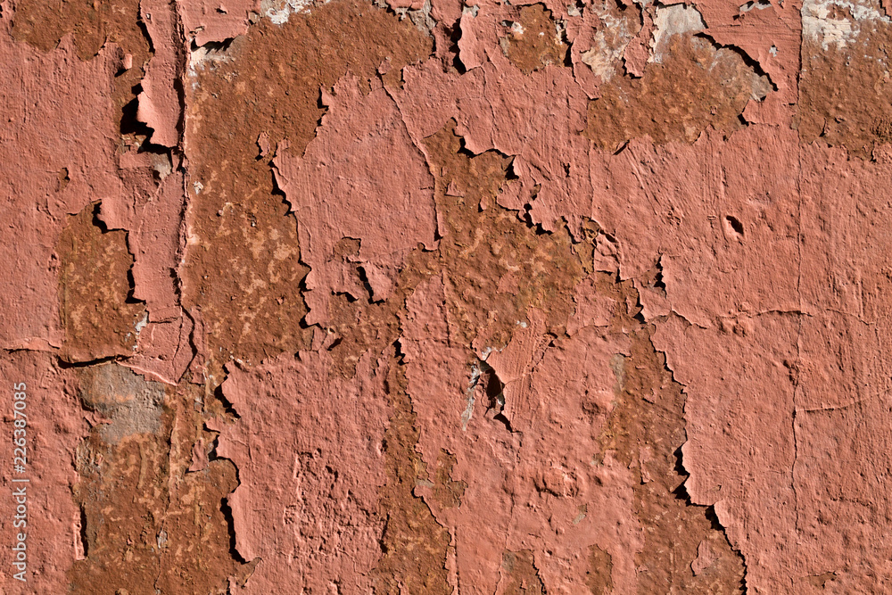 Background texture of the old shabby wall with cracks closeup Background texture of the old shabby wall with cracks closeup