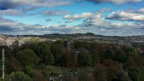 Aerial view of a Christian church and graveyard. photo