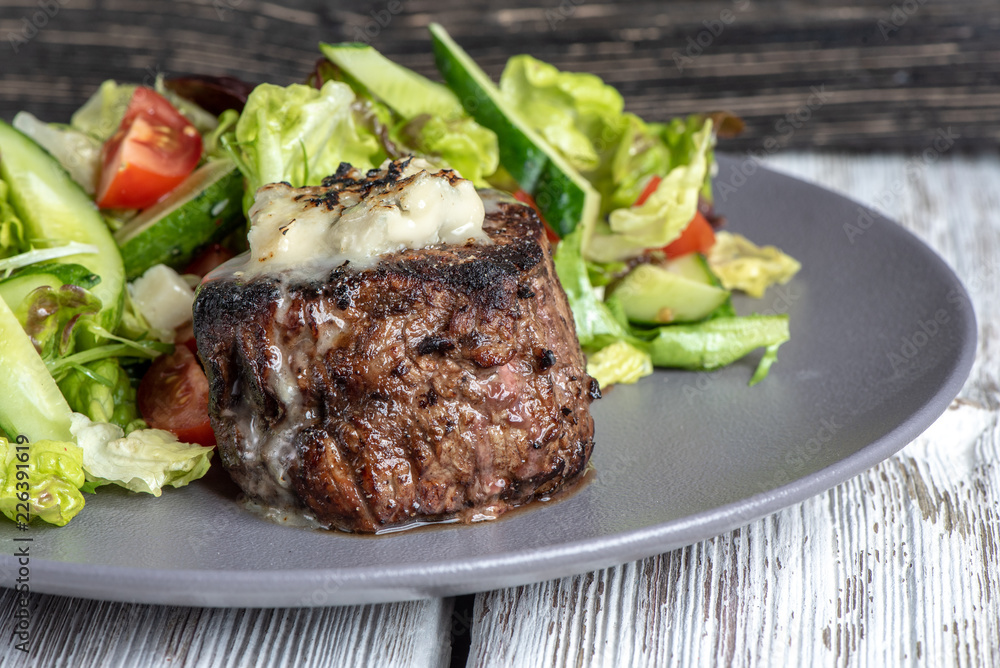 Grilled steak meat with potato gratin and vegetables Grilled steak meat with potato gratin and vegetables