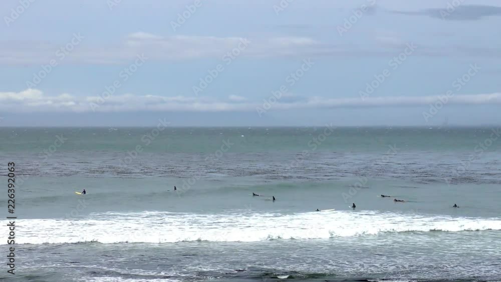 Unidentified surfers at Santa Cruz, Pleasure Point, on the northern Monterey Bay in Santa Cruz County, California, USA, a world renowned surf location Unidentified surfers at Santa Cruz, Pleasure Point, on the northern Monterey Bay in Santa Cruz County, California, USA, a world renowned surf location