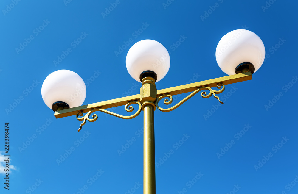 Street lamp against the blue sky Street lamp against the blue sky
