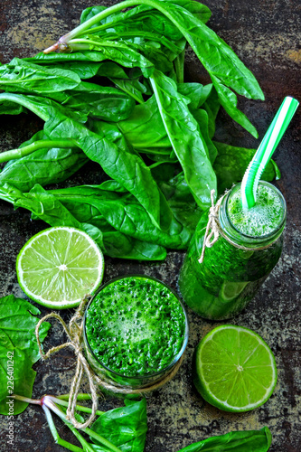 Spinach smoothie with lime juice. Detox drink with spinach and lime. Spinach drink for a good figure. Detox concept Vegan detox smoothie with spinach. © Oksana