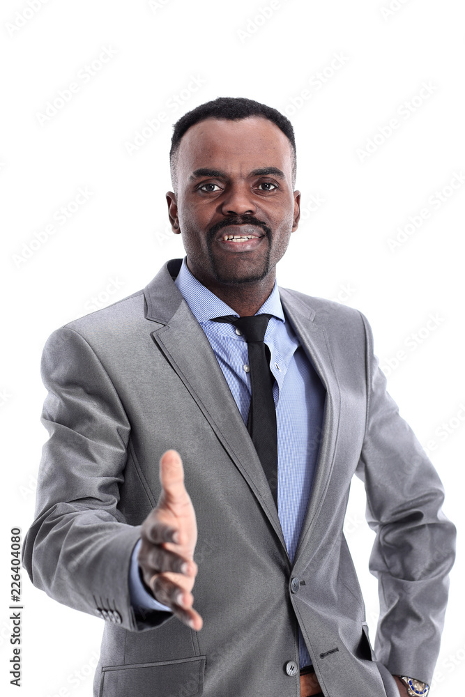 Smiling successful African American businessman giving hand. Smiling successful African American businessman giving hand.